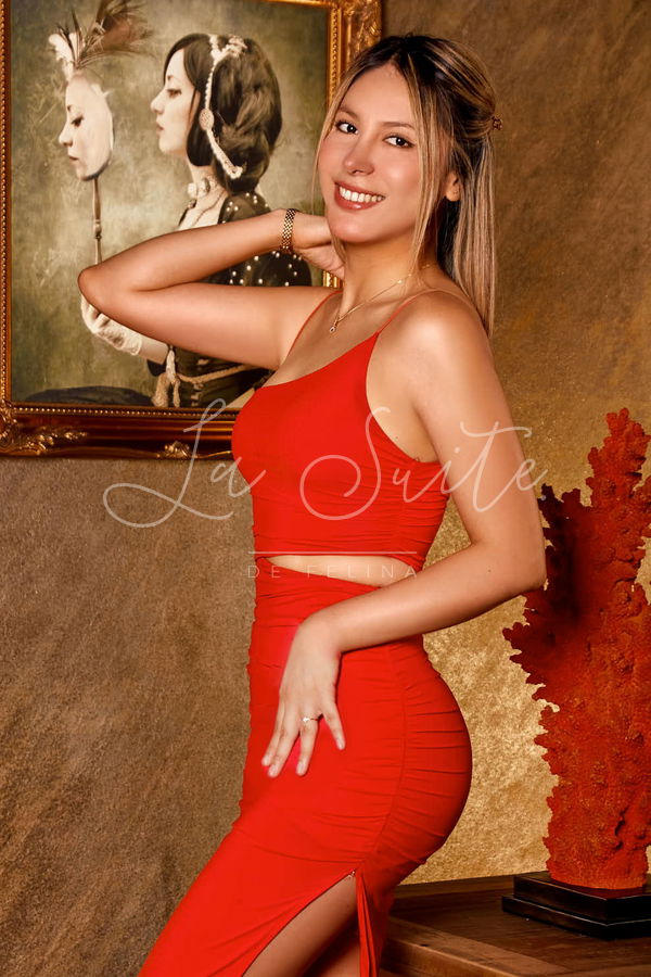 Belinda, blonde luxury escort in red gala dress at La Suite Barcelona